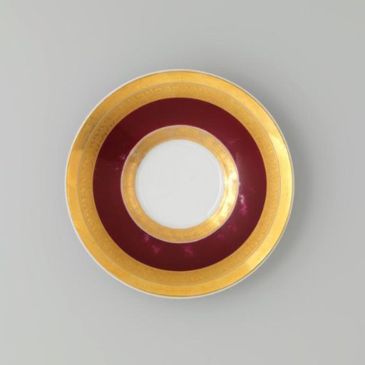 Saucer with gold borders on a red ground