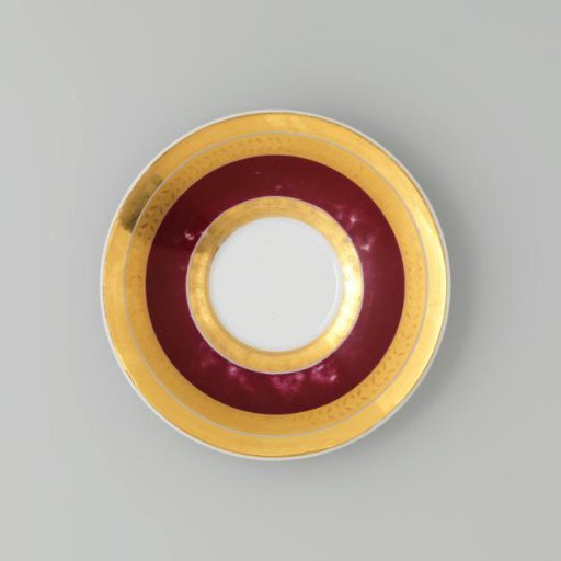 Saucer with gold borders on a red ground