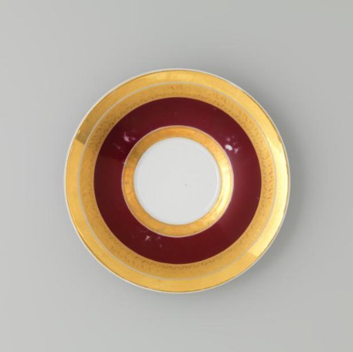 Saucer with gold borders on a red ground
