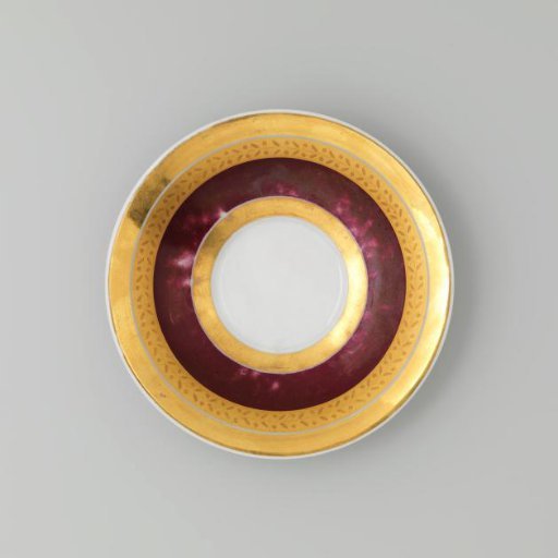 Saucer with gold borders on a red ground