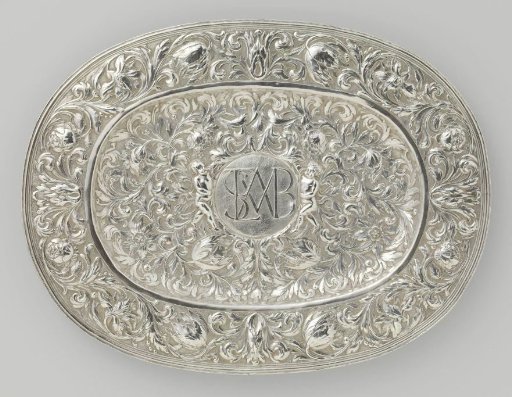 Lampstand, oval and entirely chased with floral scrolls, with a medallion in the center of the rim bearing the monogram SLMVB