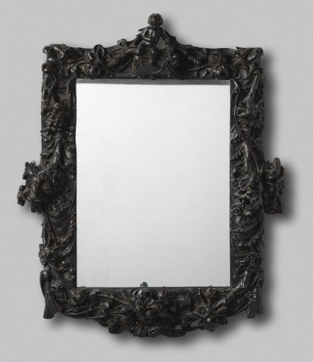 Mirror frame of carved and painted black lime wood