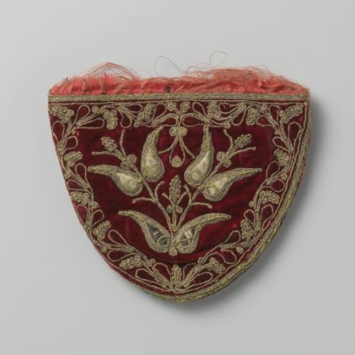 Purse in flat shield shape of purple-red velvet, embroidered in relief with gold thread