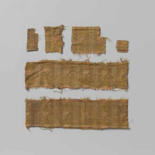 Fragment of silk brocade fabric with a pattern of pastel-colored flowers on a striped ground