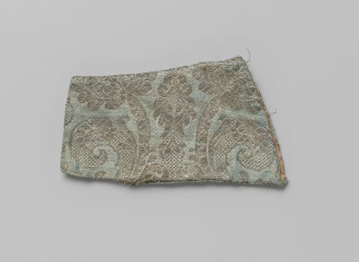 Under-sleeve from a child's jacket of silver brocade on light blue