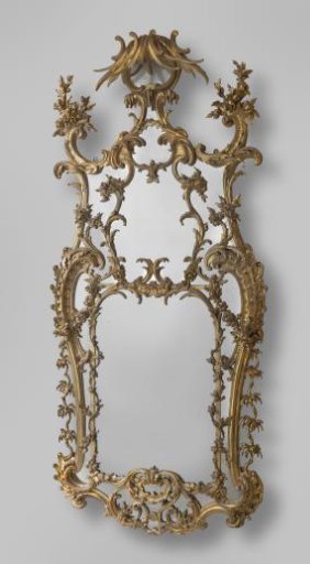 Mirror with a frame of carved and gilded wood, decorated with C-scrolls, rocailles, floral and foliate work, and an acanthus leaf, with a chinoiserie-like roof of undulating ribbon-like foliage