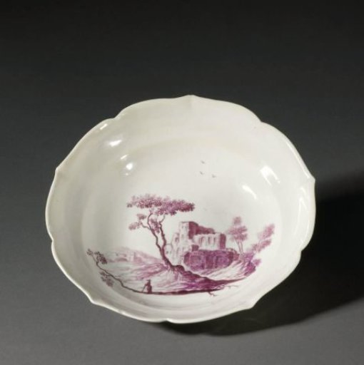 Bowl with scalloped rim, painted in purple with a landscape of ruins.