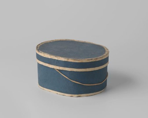 Oval hatbox of cardboard, covered with dark blue paper with white piping