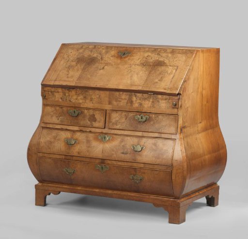 Desk with slanted flap and bombé drawer block