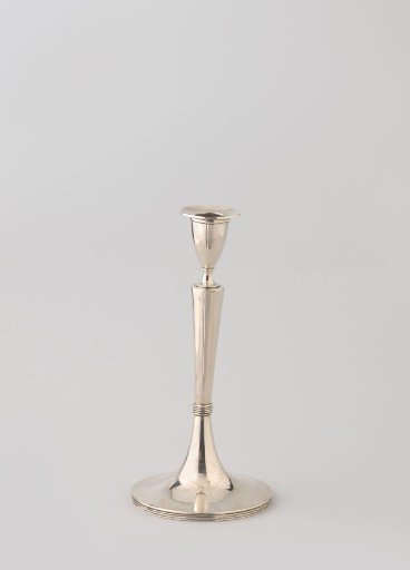 Silver candlestick on trumpet-shaped foot