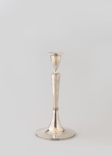 Silver candlestick on a trumpet-shaped foot