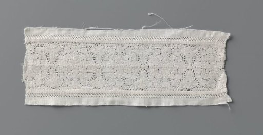 Strip of bobbin lace with linked round peonies