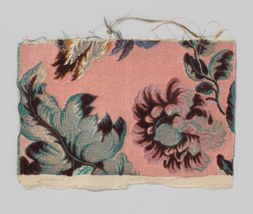 Fragment of silk weave with a large poppy on a pink ground