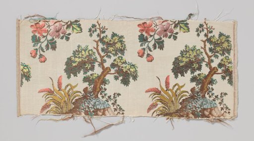 Fragment of a silk textile with a pattern of a multicoloured tree on a rock