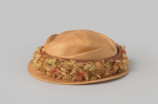 Hat of yellow straw with wreath of flowers