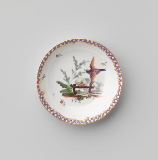 Saucer with birds in a landscape