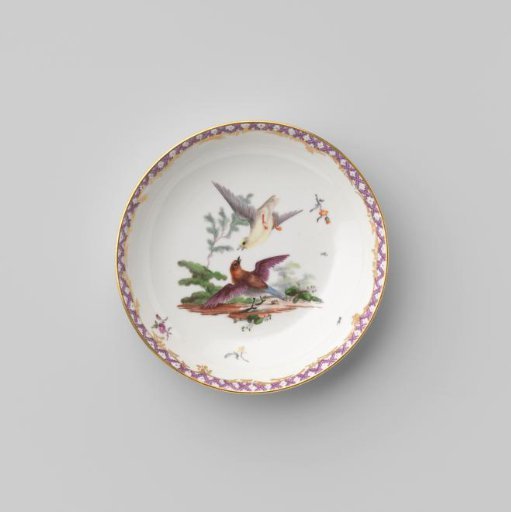 Saucer with birds in a landscape
