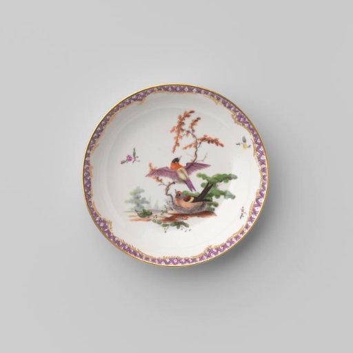 Saucer with birds in a landscape