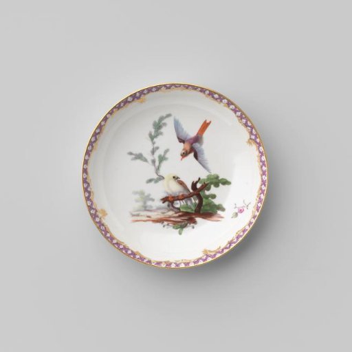 Saucer with birds in a landscape