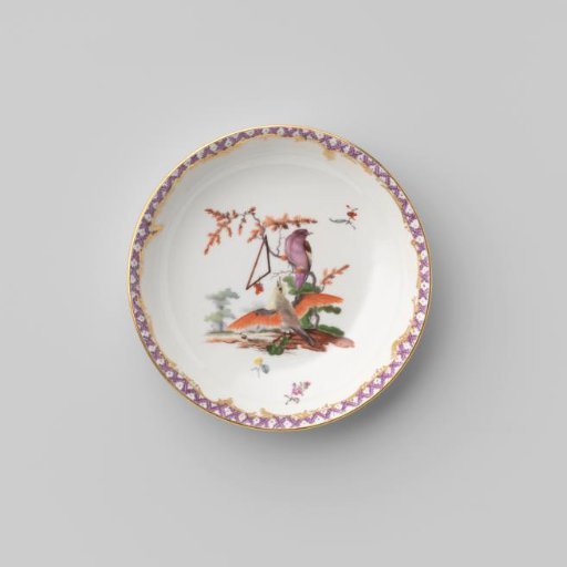 Saucer with birds in a landscape