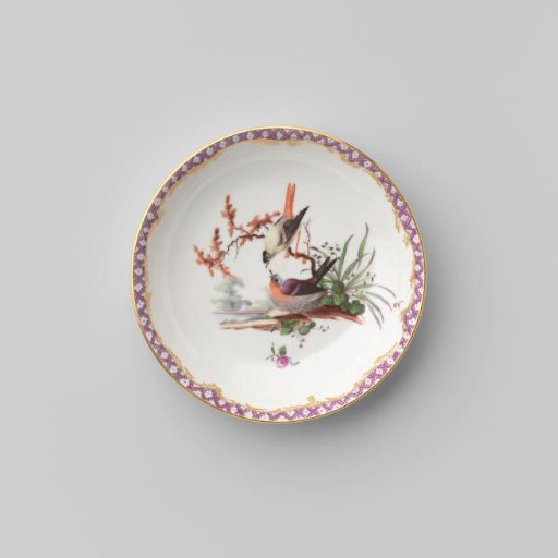 Saucer with birds in a landscape