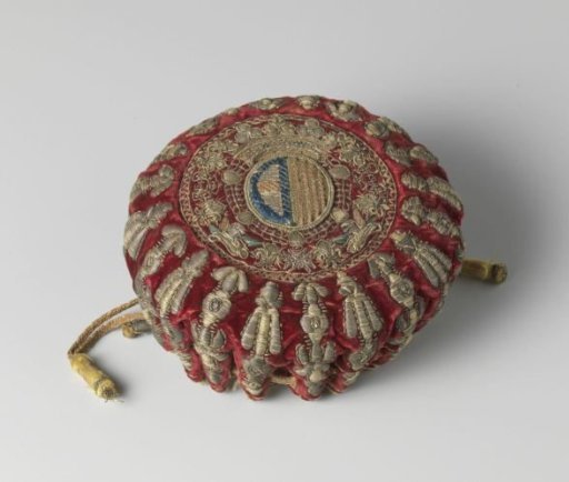 Playing card case of wine-red velvet, embroidered in gold and silver thread and multicoloured silk with an unidentified (family?) coat of arms
