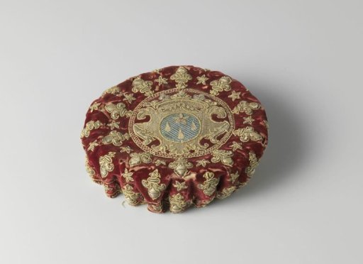 Playing card of wine-red velvet decorated with silver brocade and embroidered in silver thread and multicoloured silk with an unidentified coat of arms