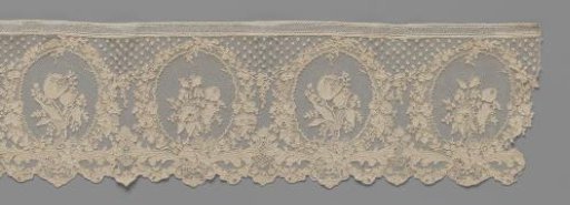 Strip of needle lace with tulip and rose branch in medallions