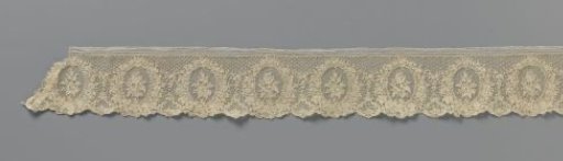 Strip of needle lace with tulip and rose branch in medallions