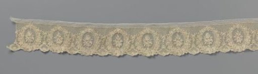 Strip of needle lace with tulip and rose branch in medallions