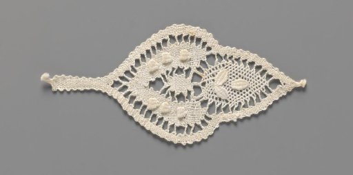 Motif of bobbin lace in the shape of a leaf with a drop and a heart