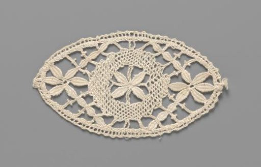 Motif of bobbin lace in the shape of an oval with a circle and three flowers inside