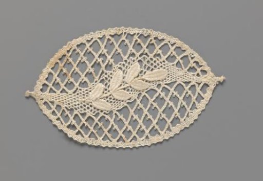 Motif of bobbin lace in the shape of an oval containing a diamond-shaped grid and a branch on a faint S-shaped field