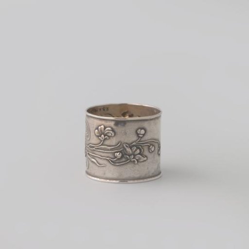 Napkin ring with a woman's head among vines.