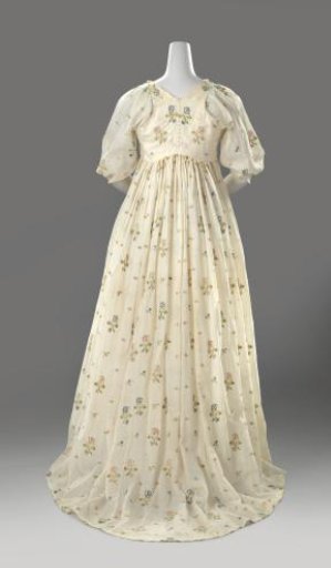 Japanese-style jacket of loosely woven cotton, long with high waist, round neck, short sleeves, gathered skirt with attached train, decorated with a scattered motif of flowers tamboured with multicoloured silk