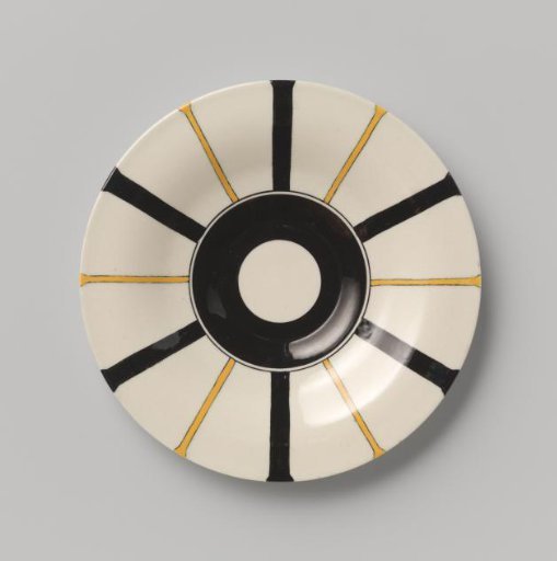 Plate with radial linear decoration in yellow and black on a cream ground