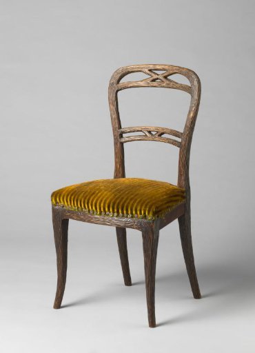 Chair and cabriolet, upholstered in green morocco leather