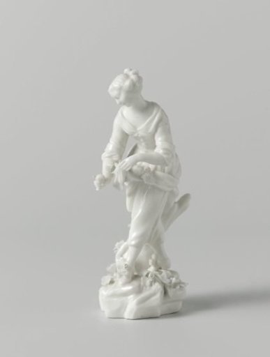 Figure of a fruit picking woman