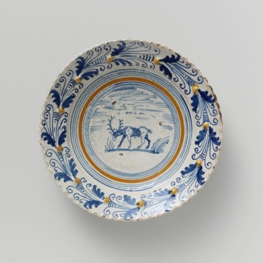 Plate, Multicolored Painted with a Stag within Concentric Circles on the Flat. Scalloped Rim with Nobs