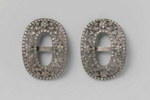 Shoe buckle of silvered copper decorated with rhinestones, oval-shaped