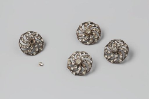 Button with a Large Stone in the Center Surrounded by Eight Small Ones on Curved Spokes