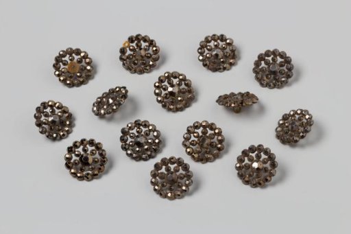 Fourteen Buttons of Polished Copper (?)