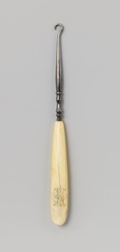 Ivory button hook with monogram JVN