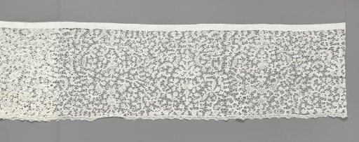 Strip of bobbin lace with candelabrum motifs for a rochet