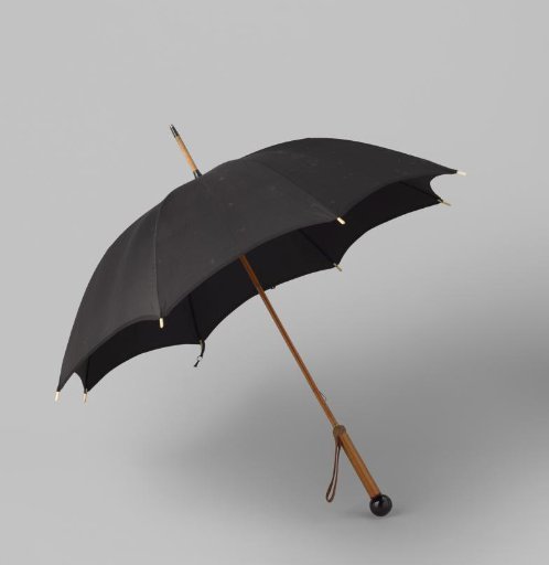 Umbrella with canopy of black silk, on a maple wood shaft with a round black metal knob