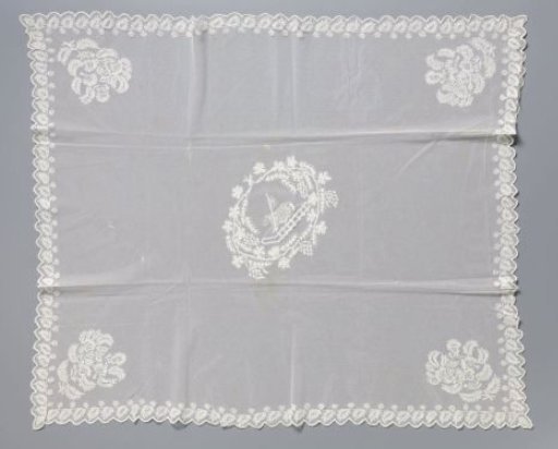 Communion cloth of lace embroidery with the lamb on a book