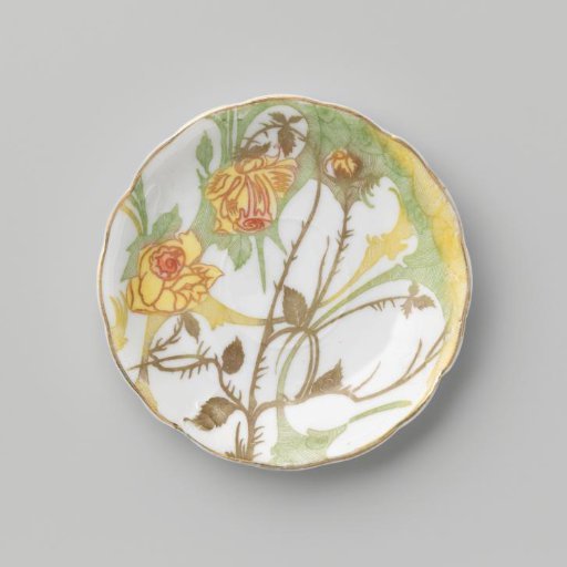 Dish decorated with relief ornament, over which a floral motif and hatched fields