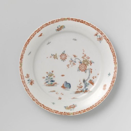 Plate with quails near flowering plants