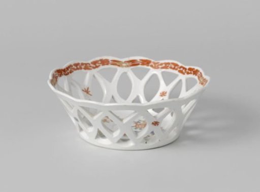 Bowl with quails near flowering plants