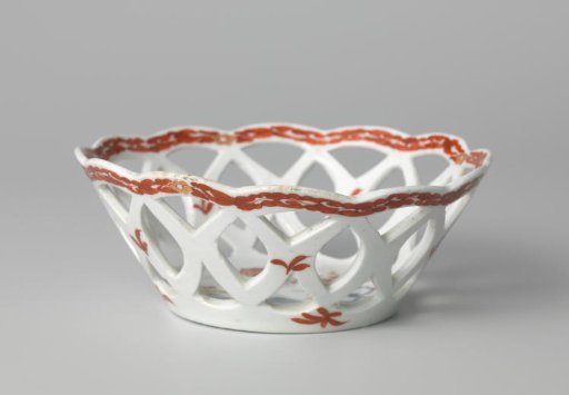 Bowl with quails near flowering plants